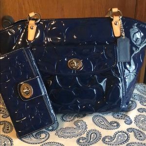 Coach shoulder bag with matching coach wallet.